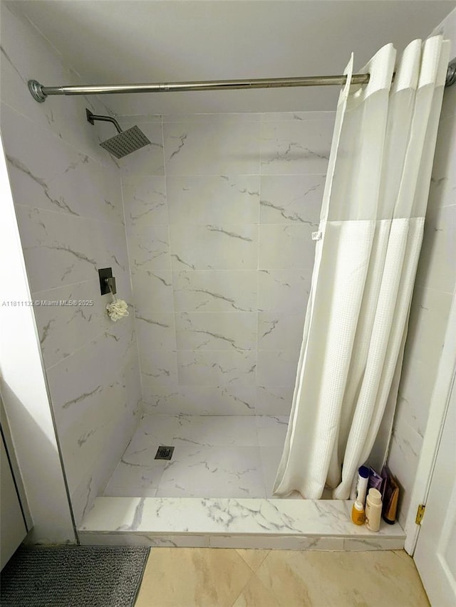 4730 NW 97th Ct Unit 76, Doral, FL 33178 - bathroom featuring marble look tiles and a marble finish shower