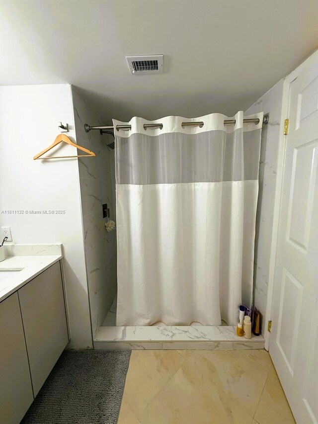 4730 NW 97th Ct Unit 76, Doral, FL 33178 - bathroom featuring a stall shower and vanity