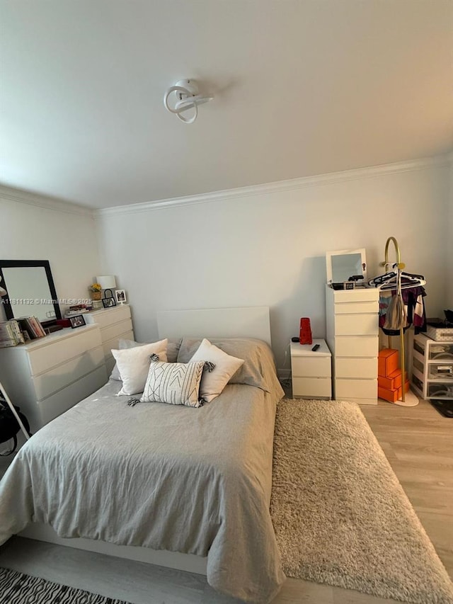 4730 NW 97th Ct Unit 76, Doral, FL 33178 - bedroom with wood finished floors and ornamental molding