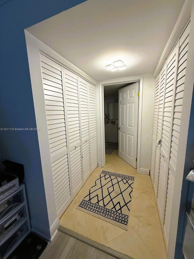 4730 NW 97th Ct Unit 76, Doral, FL 33178 - hall with light tile patterned floors and baseboards