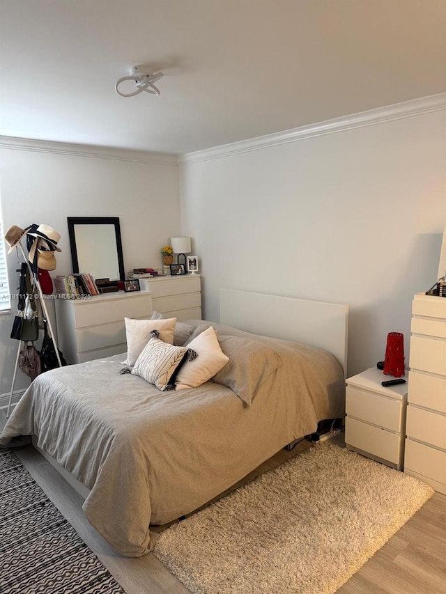 4730 NW 97th Ct Unit 76, Doral, FL 33178 - bedroom featuring ornamental molding and wood finished floors