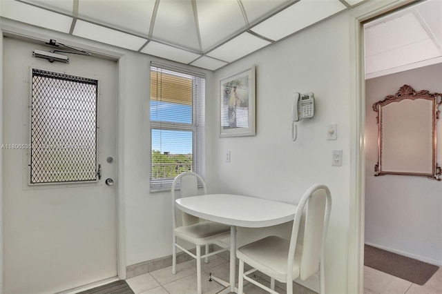 3091 N Course Dr Unit 502, Pompano Beach, FL 33069 - dining room featuring light tile patterned floors and baseboards