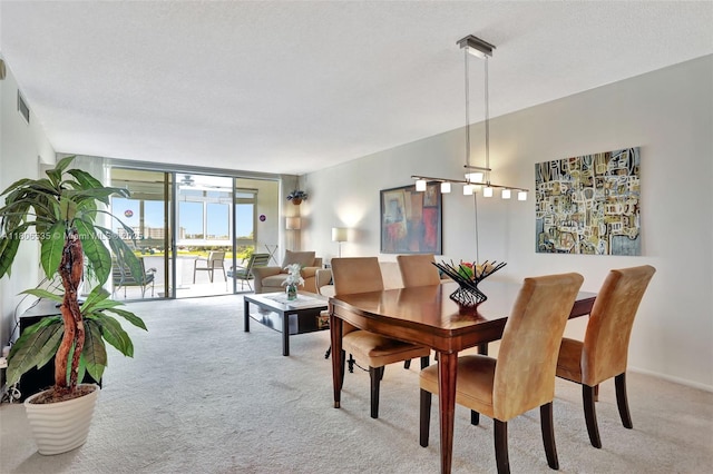 3091 N Course Dr Unit 502, Pompano Beach, FL 33069 - dining area featuring carpet flooring and floor to ceiling windows