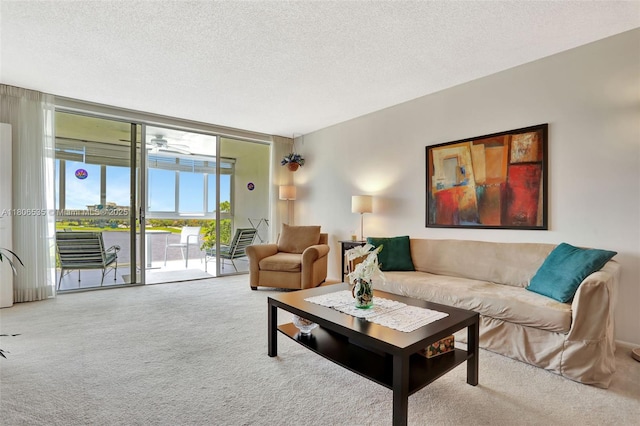 3091 N Course Dr Unit 502, Pompano Beach, FL 33069 - living area with healthy amount of natural light, carpet floors, floor to ceiling windows, and a textured ceiling