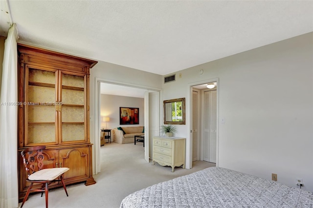 3091 N Course Dr Unit 502, Pompano Beach, FL 33069 - bedroom featuring light carpet and a closet