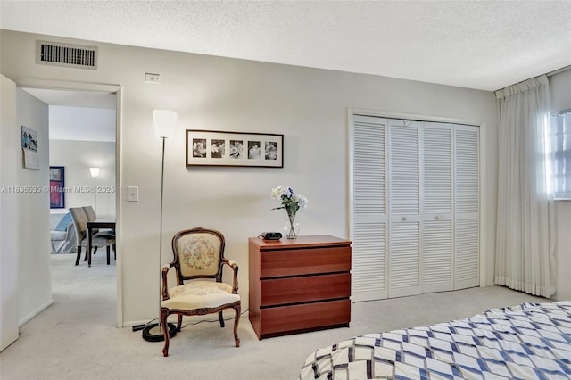 3091 N Course Dr Unit 502, Pompano Beach, FL 33069 - carpeted bedroom featuring a closet and a textured ceiling