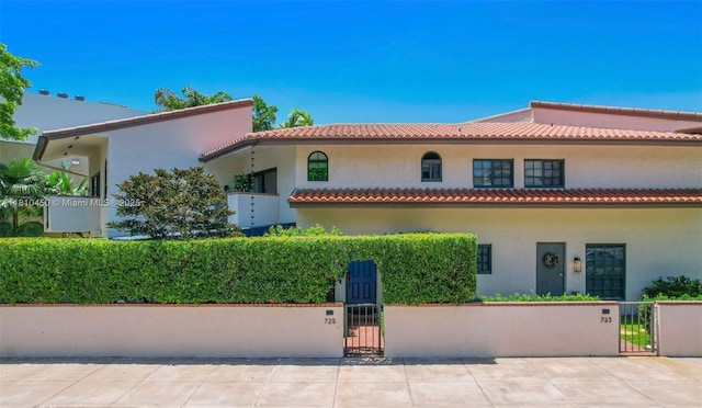 725 Biltmore Ct, Coral Gables, FL 33134 - mediterranean / spanish house featuring a gate and stucco siding