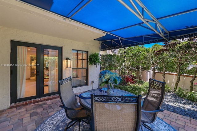 725 Biltmore Ct, Coral Gables, FL 33134 - view of patio featuring french doors and outdoor dining space
