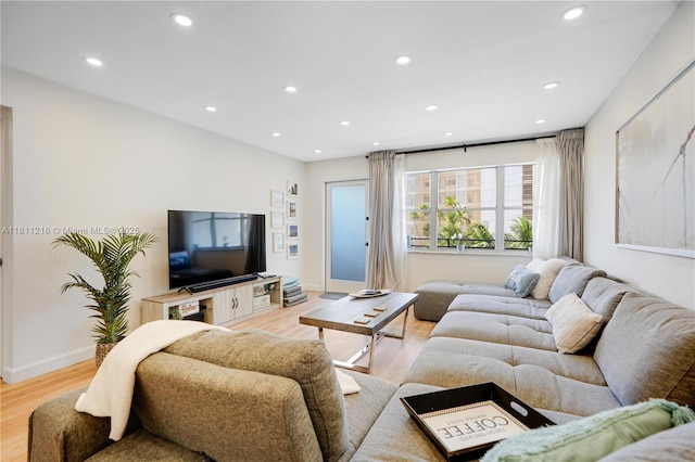 401 Golden Isles Dr Unit 302, Hallandale Beach, FL 33009 - living room with light wood-style floors, recessed lighting, and baseboards