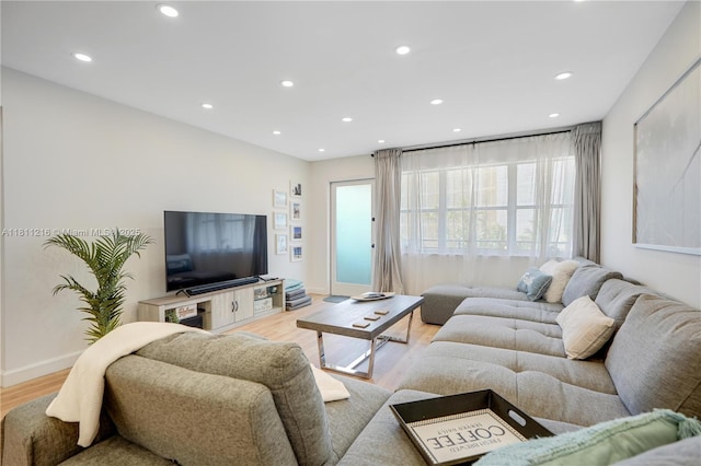 401 Golden Isles Dr Unit 302, Hallandale Beach, FL 33009 - living area featuring light wood-style floors, recessed lighting, and baseboards