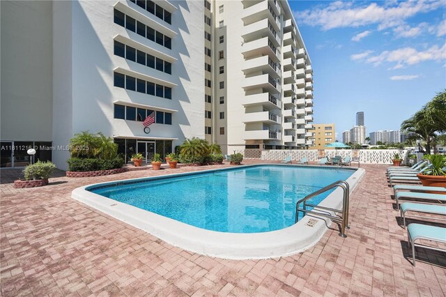 401 Golden Isles Dr Unit 302, Hallandale Beach, FL 33009 - community pool with a city view
