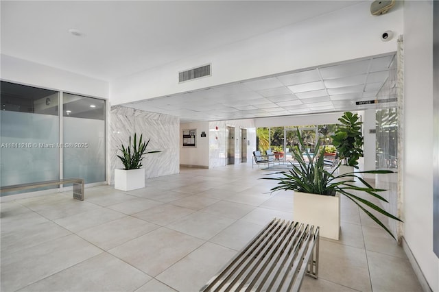 401 Golden Isles Dr Unit 302, Hallandale Beach, FL 33009 - community lobby featuring a security system