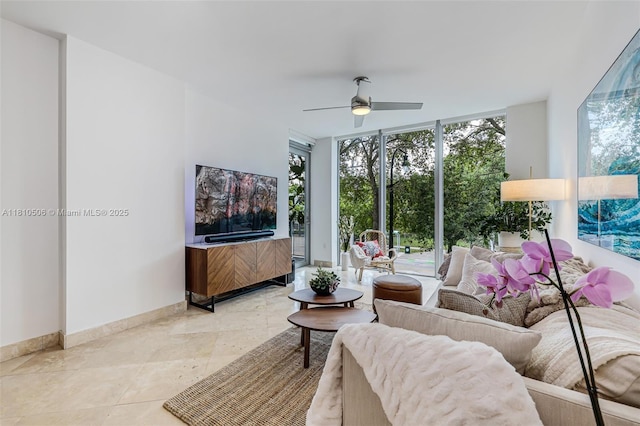 3001 SW 27th Ave Unit 201, Miami, FL 33133 - living area featuring floor to ceiling windows, a ceiling fan, light tile patterned flooring, and baseboards