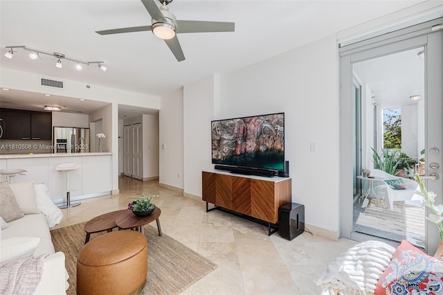 3001 SW 27th Ave Unit 201, Miami, FL 33133 - living area featuring a ceiling fan and light tile patterned floors