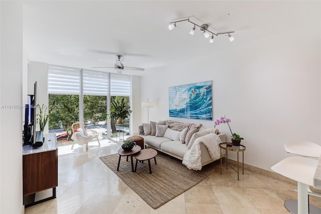 3001 SW 27th Ave Unit 201, Miami, FL 33133 - living area featuring expansive windows, ceiling fan, and light tile patterned floors