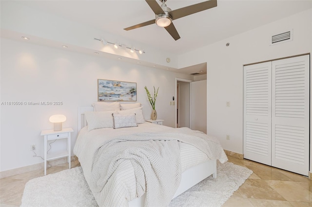 3001 SW 27th Ave Unit 201, Miami, FL 33133 - bedroom with a closet, a ceiling fan, and rail lighting
