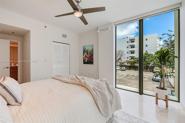 3001 SW 27th Ave Unit 201, Miami, FL 33133 - bedroom with access to outside, tile patterned floors, a closet, and ceiling fan