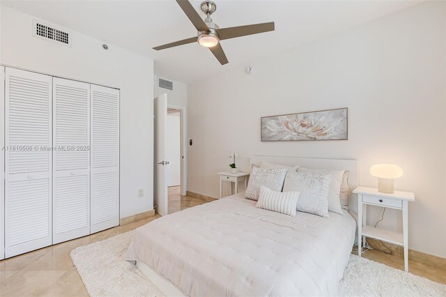 3001 SW 27th Ave Unit 201, Miami, FL 33133 - tiled bedroom featuring a closet, ceiling fan, and baseboards