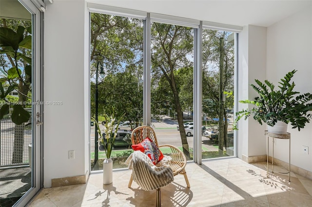 3001 SW 27th Ave Unit 201, Miami, FL 33133 - entryway with floor to ceiling windows and healthy amount of natural light