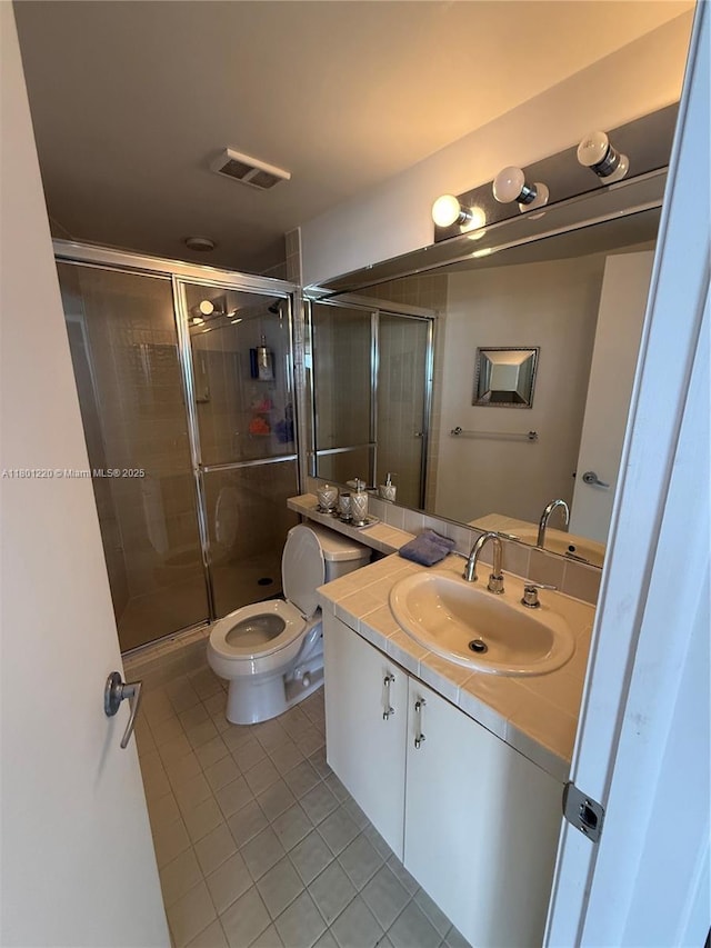 1000 Island Blvd Unit 911, Aventura, FL 33160 - bathroom featuring tile patterned floors, vanity, toilet, and a stall shower