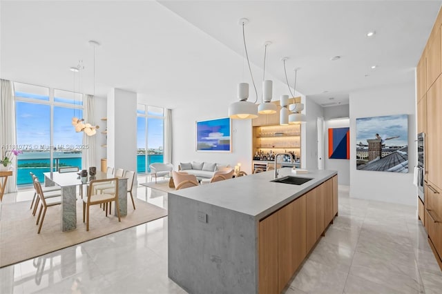 725 NE 22nd St Unit Ph3C, Miami, FL 33137 - kitchen featuring modern cabinets, a sink, a water view, a spacious island, and oven
