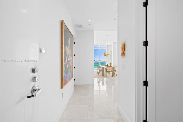 725 NE 22nd St Unit Ph3C, Miami, FL 33137 - hall with baseboards and light marble finish floors