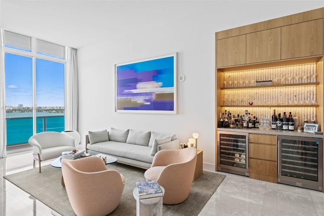 725 NE 22nd St Unit Ph3C, Miami, FL 33137 - indoor dry bar featuring beverage cooler, a wall of windows, and a water view