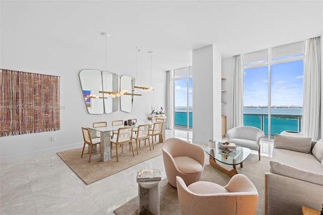 725 NE 22nd St Unit Ph3C, Miami, FL 33137 - living room featuring a water view and expansive windows
