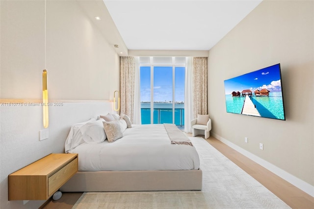 725 NE 22nd St Unit Ph3C, Miami, FL 33137 - bedroom with wood finished floors and baseboards
