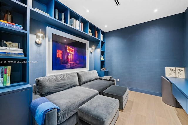 725 NE 22nd St Unit Ph3C, Miami, FL 33137 - cinema room with built in shelves, wood finished floors, and recessed lighting