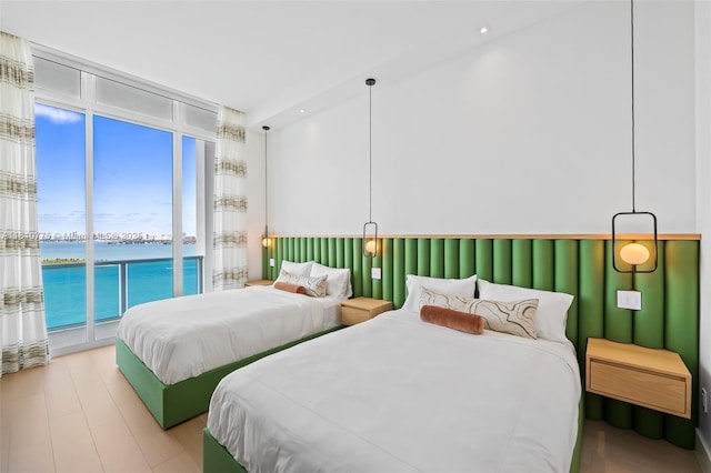 725 NE 22nd St Unit Ph3C, Miami, FL 33137 - bedroom featuring a water view, access to outside, and a wall of windows