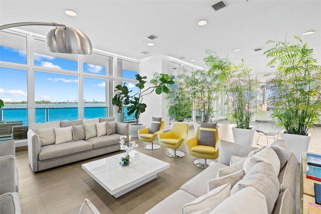 725 NE 22nd St Unit Ph3C, Miami, FL 33137 - community lobby with a water view, recessed lighting, and a wall of windows