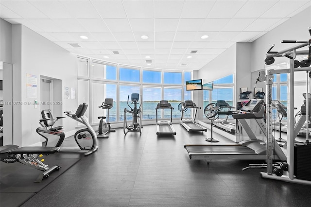 725 NE 22nd St Unit Ph3C, Miami, FL 33137 - gym with a paneled ceiling, a wall of windows, and recessed lighting