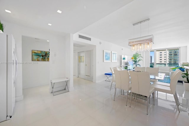 19370 Collins Ave Unit 902, Sunny Isles Beach, FL 33160 - dining room featuring a chandelier