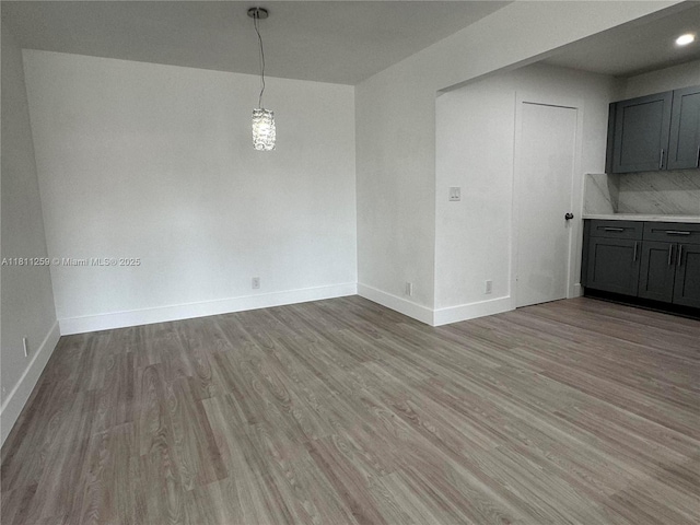 12801 SW 43rd Dr Unit 212-A, Miami, FL 33175 - unfurnished dining area with light wood-type flooring and baseboards