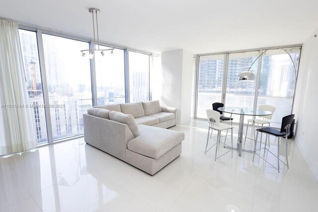 475 Brickell Ave Unit 1715, Miami, FL 33131 - living area featuring expansive windows, plenty of natural light, and tile patterned floors
