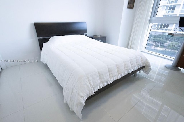 475 Brickell Ave Unit 1715, Miami, FL 33131 - tiled bedroom featuring multiple windows
