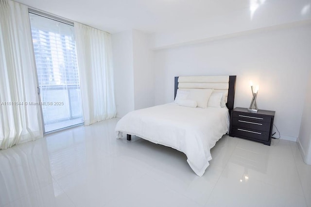 475 Brickell Ave Unit 1715, Miami, FL 33131 - bedroom featuring access to exterior and light tile patterned floors