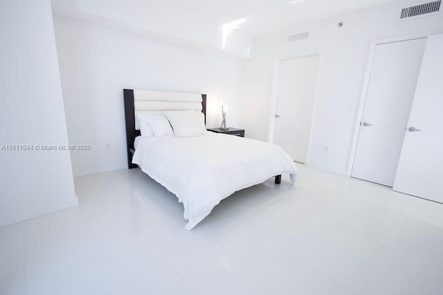 475 Brickell Ave Unit 1715, Miami, FL 33131 - bedroom featuring light tile patterned floors