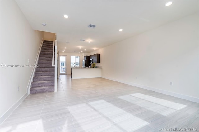 10226 NW 64th Ter Unit 104, Doral, FL 33178 - unfurnished living room with stairway, baseboards, recessed lighting, and light tile patterned floors