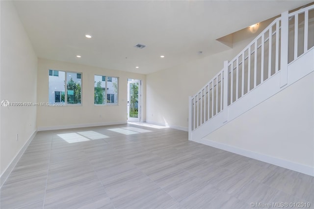 10226 NW 64th Ter Unit 104, Doral, FL 33178 - unfurnished living room with stairway, baseboards, recessed lighting, and tile patterned flooring