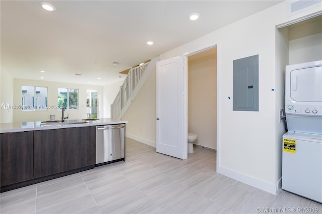 10226 NW 64th Ter Unit 104, Doral, FL 33178 - kitchen featuring dishwasher, electric panel, a sink, dark brown cabinetry, and stacked washer and clothes dryer