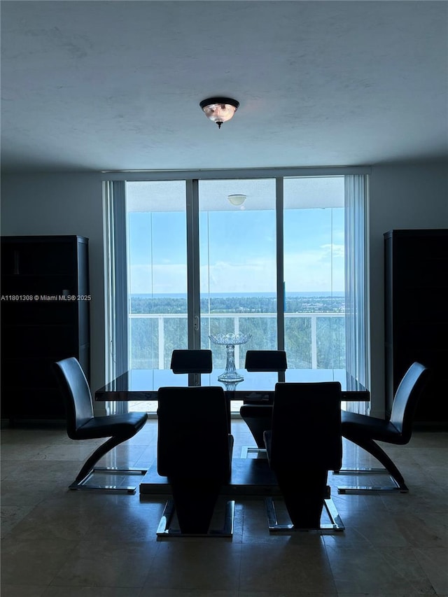 14951 Royal Oaks Ln Unit 1804, North Miami, FL 33181 - dining room featuring a wall of windows and healthy amount of natural light
