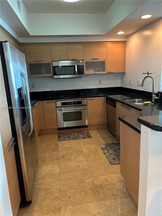 14951 Royal Oaks Ln Unit 1804, North Miami, FL 33181 - kitchen featuring appliances with stainless steel finishes, a peninsula, dark countertops, and recessed lighting