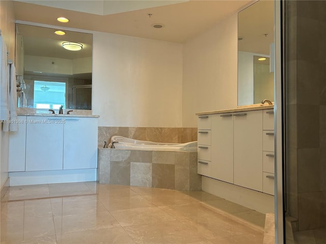 14951 Royal Oaks Ln Unit 1804, North Miami, FL 33181 - full bathroom with vanity, a garden tub, a shower stall, and tile patterned floors