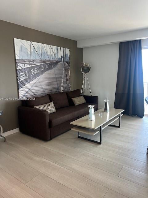11111 Biscayne Blvd Unit 8C, Miami, FL 33181 - living area with light wood-type flooring
