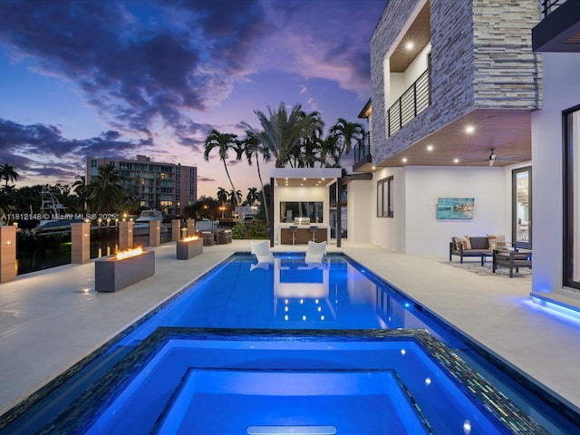 401 Bontona Ave, Fort Lauderdale, FL 33301 - view of swimming pool with an outdoor living space with a fire pit, area for grilling, a patio, ceiling fan, and a pool with connected hot tub