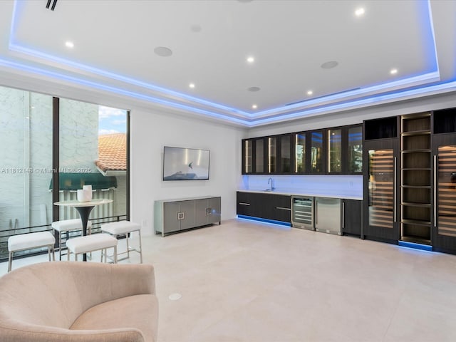 401 Bontona Ave, Fort Lauderdale, FL 33301 - living area with a raised ceiling, wine cooler, bar with sink, and recessed lighting