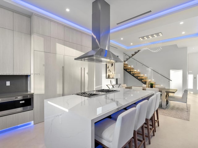 401 Bontona Ave, Fort Lauderdale, FL 33301 - kitchen featuring island exhaust hood, modern cabinets, stainless steel gas stovetop, a spacious island, and recessed lighting