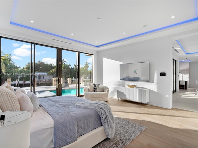 401 Bontona Ave, Fort Lauderdale, FL 33301 - bedroom featuring access to outside, light wood finished floors, a raised ceiling, french doors, and recessed lighting